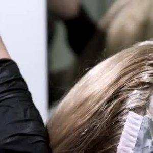 Depositphotos 205558280stockvideohairdyeingapplyingcolorto
